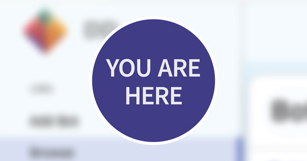 Blurred app background with a 'You Are Here' map-style badge